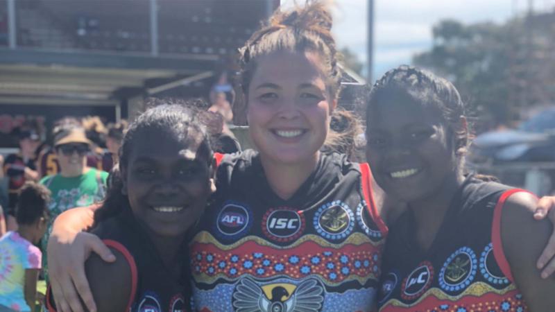 Ms Amber Alexander on the footy field.