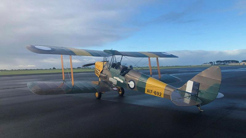 Corporal Adam Scerri and Flight Lieutenant Brett Alderton in a Tiger Moth in 2022.