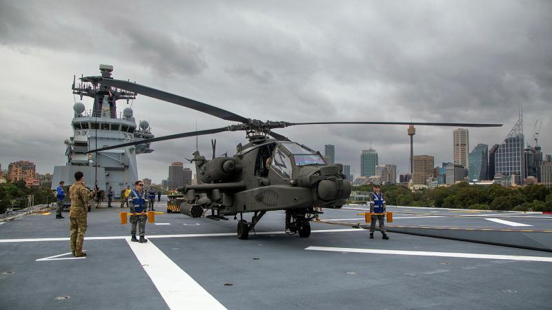 A US Army AH-64E Apache conducted a series of deck-based training activities aboard HMAS Canberra while alongside at Fleet Base East in Sydney. Photos: Petty Officer Helen Frank