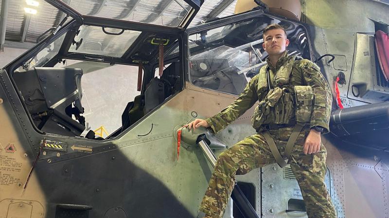Army pilot Captain Andrew Amos stands bedside an Armed Reconnaissance Helicopter Tiger at 1st Aviation Regiment at Robertson Barracks, Darwin. Photo: Flight Lieutenant Nicholas O'Connor