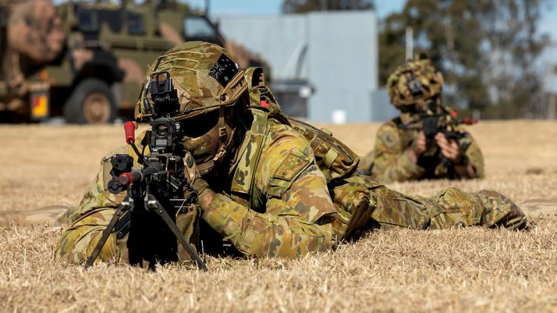 Aviators from No. 2 Security Forces Squadron (2SECFOR) dismount from a Bushmaster protected mobility vehicle during Exercise Nomad Walk at RAAF Base Amberley, QLD. Photos: Corporal Kieren Whitely
