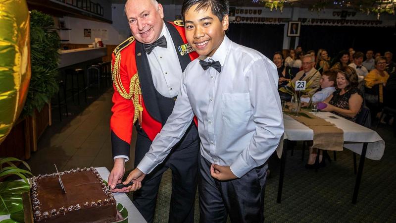 Major General Douglas Laidlaw cuts the cake with Cadet Zhyler Cawit during the 230 Army Cadet Unit 25th anniversary celebration. Photo: Shane Brandon