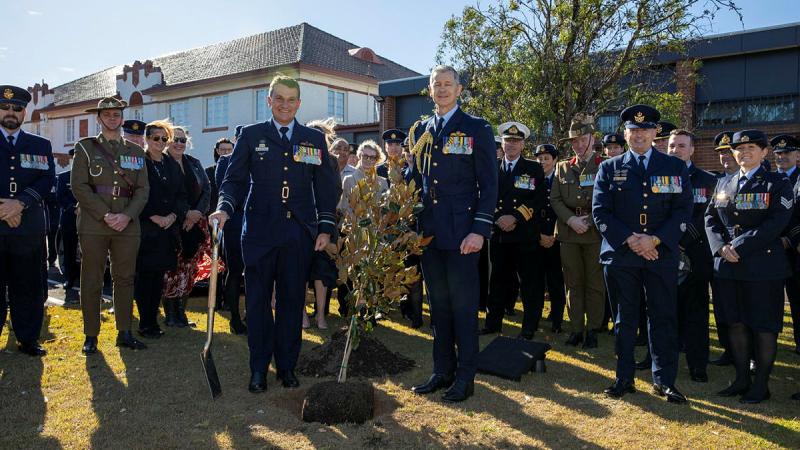 Outgoing Air Commander Australia, Air Marshal Darren Goldie, left, and Incoming Air Commander Australia, Air Vice-Marshal Glen Braz, right, plant a tree after the change of command ceremony at RAAF Base Glenbrook. Photos: Leading Aircraftman Chris Tsakisiris