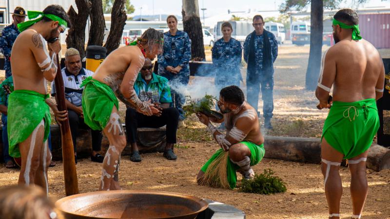 Performers from Wulgurukaba Traditional Custodian Group participate in a smoking ceremony to celebrate the opening of the yarning circle at RAAF Base Townsville.