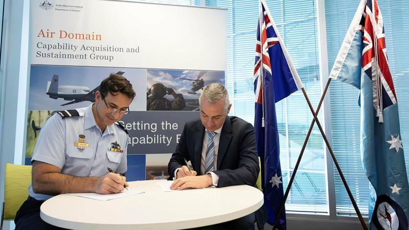 Air Commodore Steve Pesce and Mr Steve Green signing a three-year contract to provide services as Air Domain's 'Aerospace Propulsion Centre of Expertise'. Photo: Private Nicholas Marquis