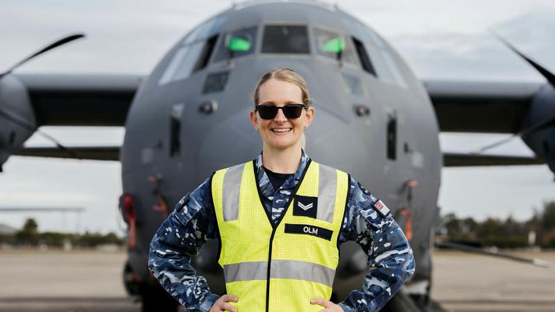 Corporal Teneale Olm from 22 Squadron Air Movements section stands in front of a US Air Force AC-130J Ghostrider at RAAF Base Richmond during Exercise Teak Action. Photo: Corporal John Solomon