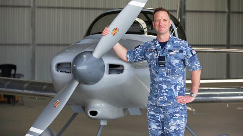 Squadron Leader Daniel Olsen with the plane he built, at Canberra Aero Club.