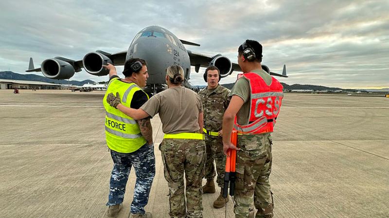 RAFF and USAF members work together during the arrival of a USAF C-17 Globemaster III into RAAF Base Townsville from Joint Base Charleston, South Carolina, as part of Exercise Mobility Guardian. Photo: Flight Lieutenant Tanya Carter
