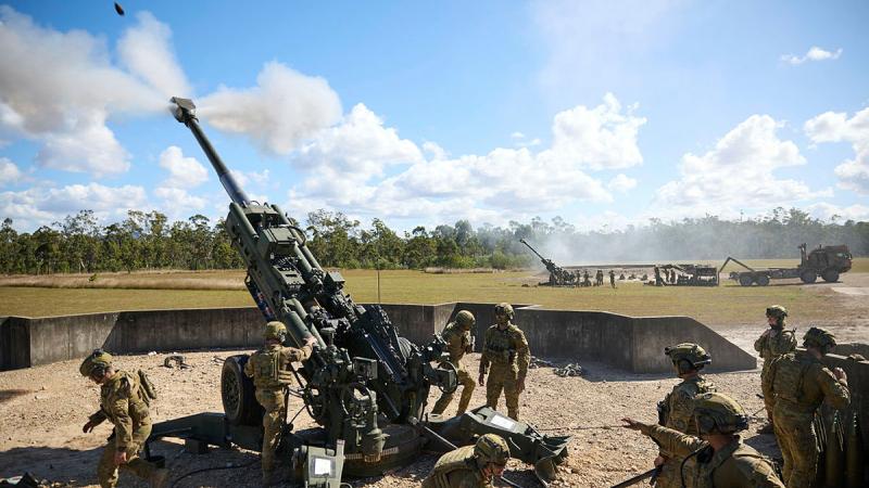 Gunners from the 4th Regiment, Royal Australian Artillery fire M777 howitzers in support of infantry. Photo: Lieutenant Stephen Hunter