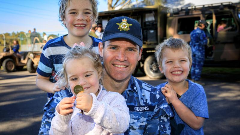 The Gibbins family including, Tommy 8, Johnny 5, Betty 3 and Dad Stephen enjoy the activities on display at the Defence member and family support Child of the Medallion event at RAAF Base Williamtown, NSW.