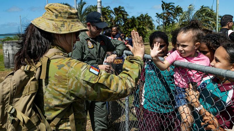 Corporal Jordan Oakley and Corporal Ashleigh Shannon greet members of the Badu Island community, during Exercise Coastwatcher Wallaby 23.