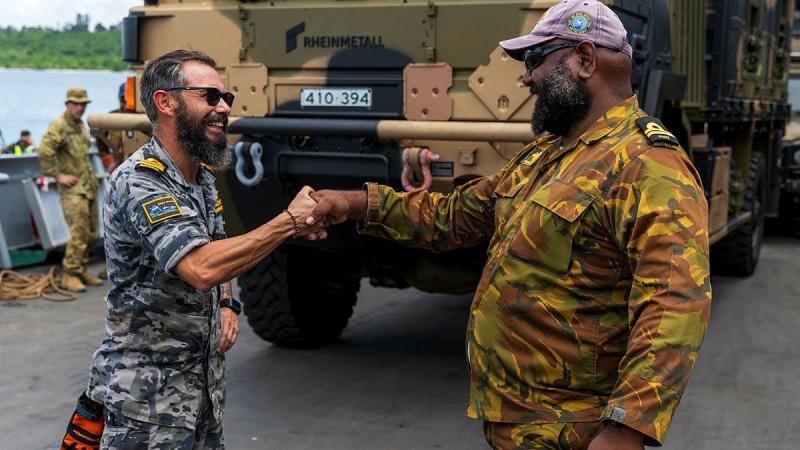 Commanding Officer HMPNGS Cape Gloucester, Lieutenant Bryan Pohai, reunites with old friend, ADV Reliant Naval Liaison Officer, Lieutenant Commander Brenton-James Glover, alongside at Manus Island. Photos: Corporal Lisa Sherman