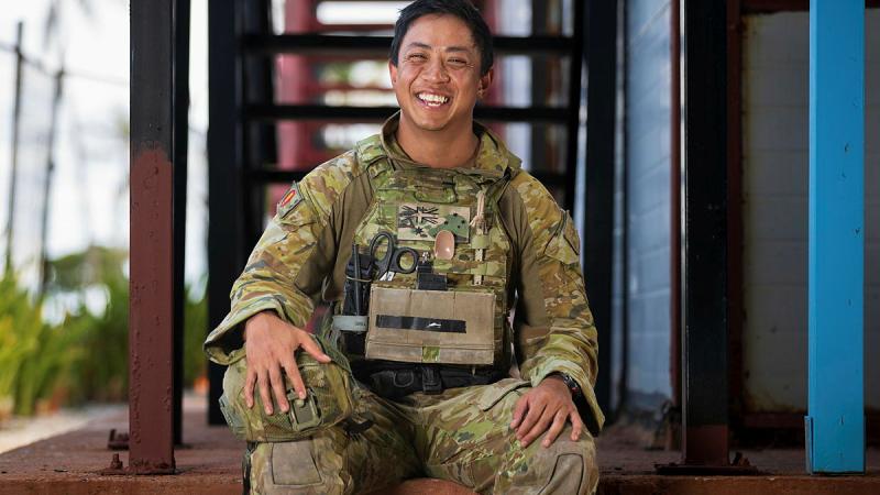 Australian Army explosive ordnance disposal technician Sergeant Haron Sarmiento smiles after rendering safe a 500lb unexploded ordnance 