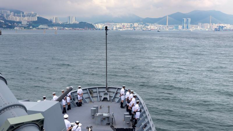 HMAS Anzac sailors line the forecastle as the ship arrives at Busan Naval Base, Republic of Korea during a regional presence deployment.