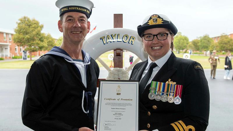 Commanding Officer Royal Australian Navy (RAN) Recruit School, Commander Alisha Withers, right, promotes Seaman Stephen Thompson to the rank of Able Seaman.