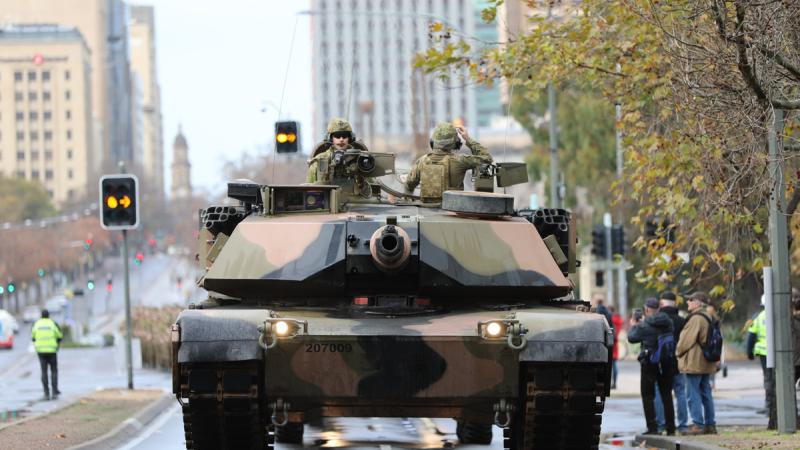 An Australian Army Abrams main battle tank drives down an Adelaide street.