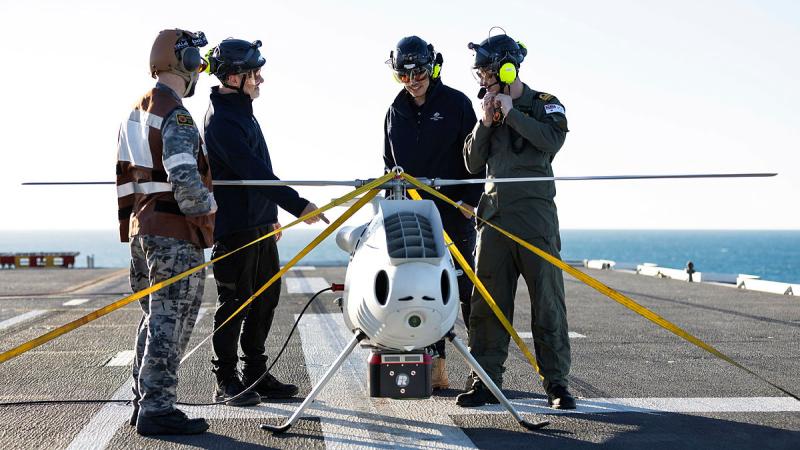 Navy crew aboard the Flight Deck of HMAS Adelaide