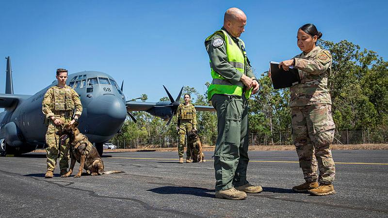 Aviators standing on the tarmac