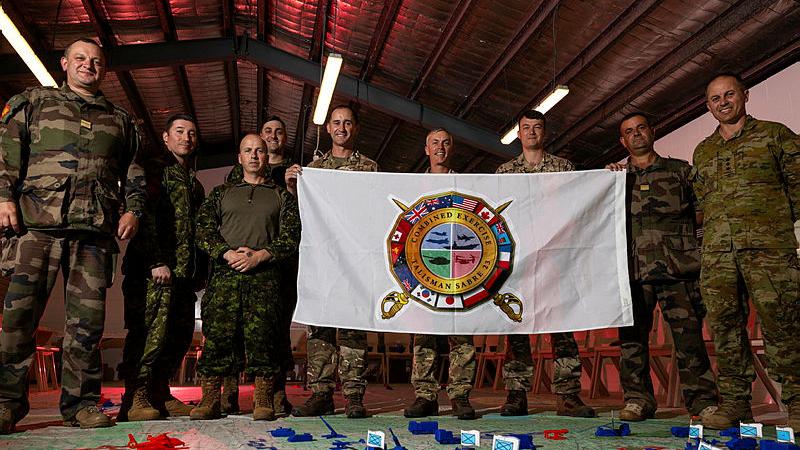 International participants of Exercise Talisman Sabre, representing the Combat Training Centres of France, Canada and the UK, with Colonel Ben McLennan (ADF), far right. 
