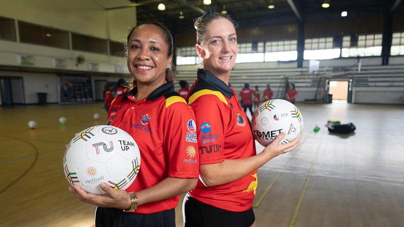 Mrs Tui Alu, left, and Warrant Officer Class 1 Kimberly Kiely at the ADF Sports training program in Papua New Guinea. 