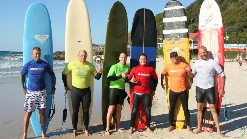 From left, Marcel van Kampan, Army officer Major Myles Conquest, Navy Lieutenant Ed Bramich, and Able Seamans Cameron Stewart, Luis Mori Hernandez, and Jason Weeks with their boards after the final of the Kirra Longboard Klassic at the Gold Coast. 