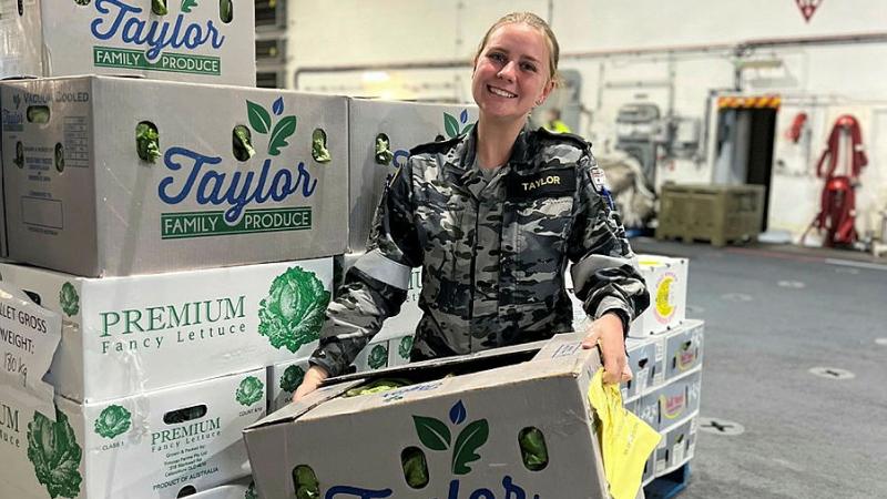 Navy Officer Year One, Maritime Logistics Trainee Midshipman Courtney Taylor on board HMAS Canberra unpacking her family's farm produce, while loading stores in Townsville, Queensland.