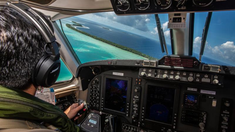 View from the cockpit during a Royal Australian Air Force KA350 King Air flight over Tuvalu waters.