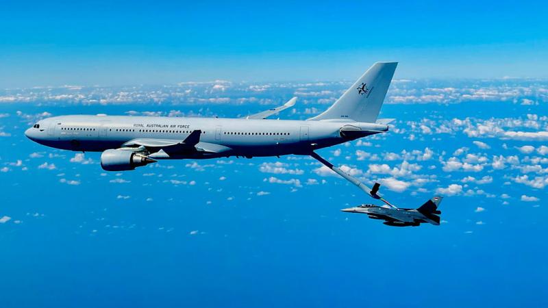 Two aircrafts completing air-to-air refuelling. 