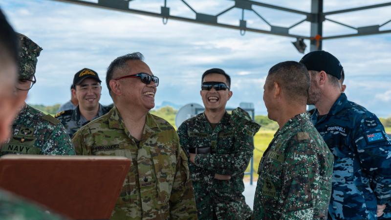 Australian Army officer Major Bayani Fernandez (centre) shares a laugh with his counterparts from the Armed Forces of the Philippines on Indo-Pacific Endeavour 2023 in the Philippines.