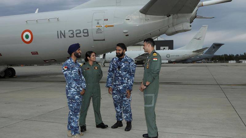 Two aviators and two sailors having a chat.