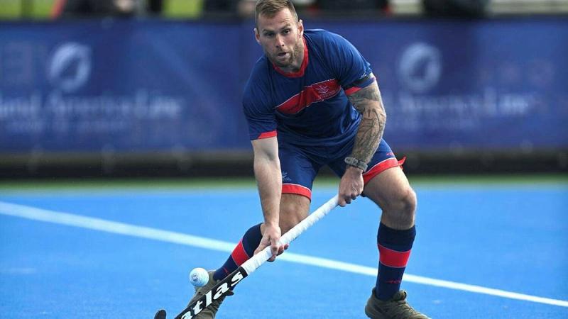 Corporal Zac Simpson lining up the ball to hit towards the opponent's goal.