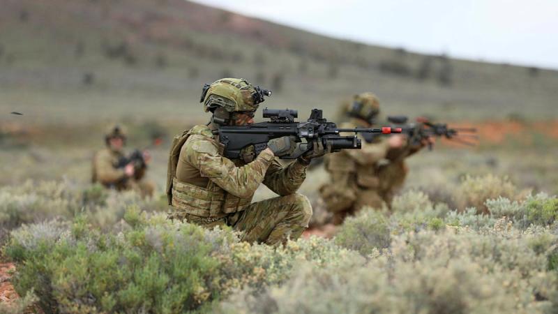 Soldier fires his gun 