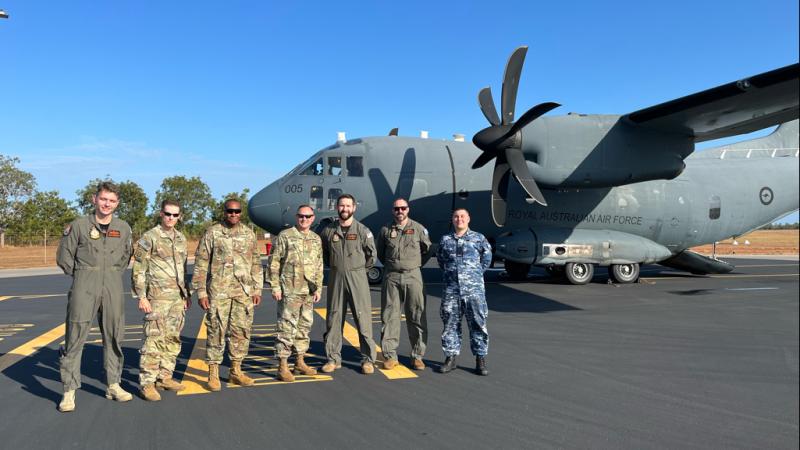 Pilots and crew members from the Royal Australia Air Force flank members from the 8th Theater Sustainment Command upon completion of the RAAF’s first flight as a chartered member of the Movement Control Center – Europe during Talisman Sabre. 