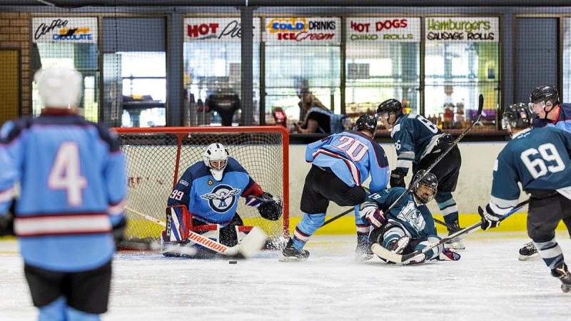 ADF personnel playing ice hockey.