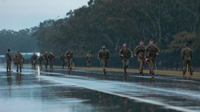 ADF candidates participating in the 4 Squadron Combat Control Suitability Screening do a 3.2km run in the rain as part of the Special Forces entry test.