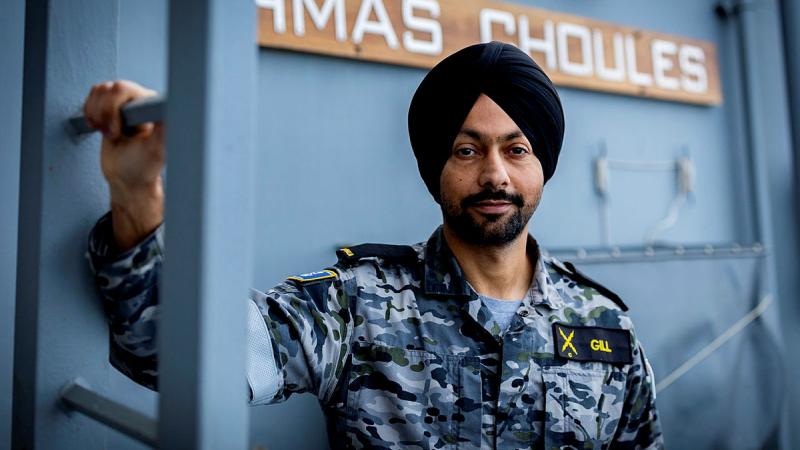 Able Seaman Mandeep Gill on the upper decks of HMAS Choules during Exercise Malabar. Photo: Leading Seaman David Cox