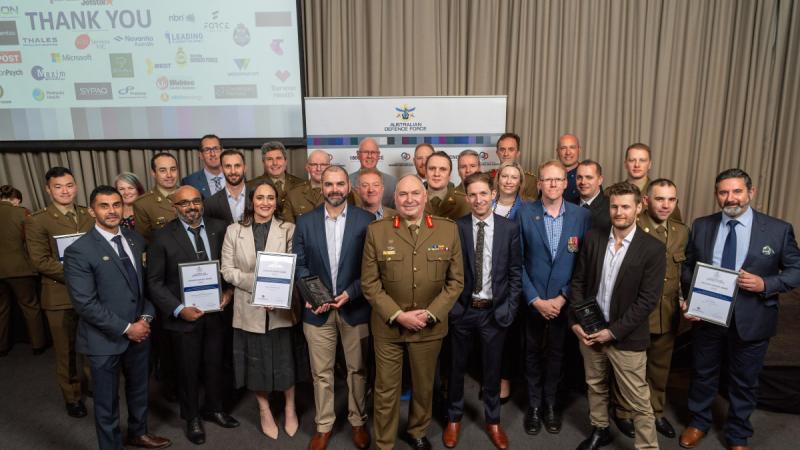 Major General Douglas Laidlaw, centre, with reservists and their award-winning civilian employers at the ADF Reserves and Employer Support Awards – Victoria.