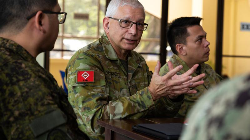 Australian Army medical officer Major Peter Del Fante in discussion during Pacific Partnership 2023.
