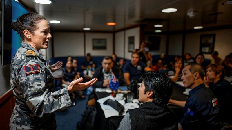 Commander Amphibious Task Force Captain Phillipa Hay speaks to members of a humanitarian aid and disaster relief tabletop exercise on board HMAS Canberra, near Manila, Philippines, during Exercise Alon. Photo: Corporal Robert Whitmore
