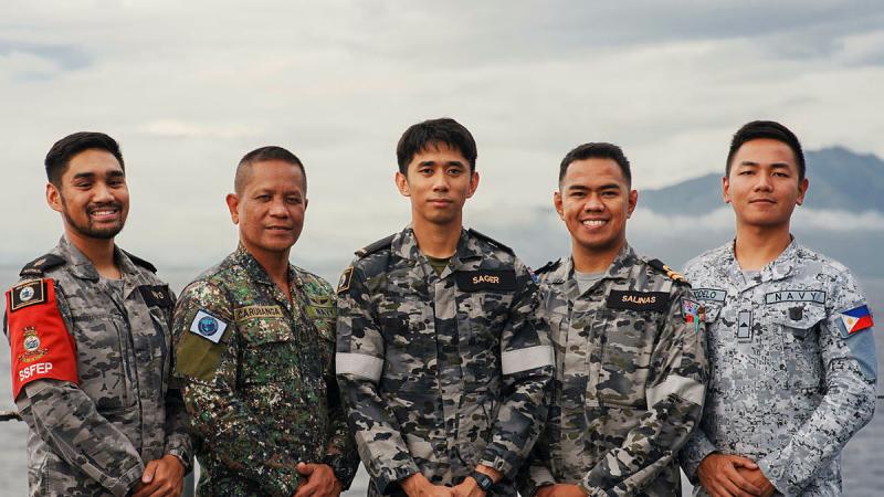 from left, RAN Able Seaman Marc Moyo, Philippine Marine Corps Master Sergeant Vincente Carubanga Jr, Australian Army Private Melanio Sager, RAN Medical Officer Lieutenant Phil Salinas and Philippine Navy Apprentice Seaman Cedrick Marcelo on HMAS Canberra near Manila, Philippines during Exercise Alon. 