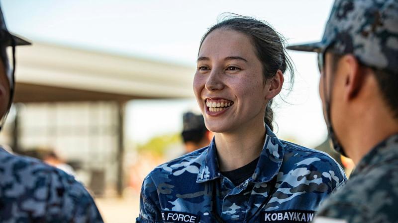 Flying Officer Ema Kobaykawa chats with Japan Air Self-Defense personnel.