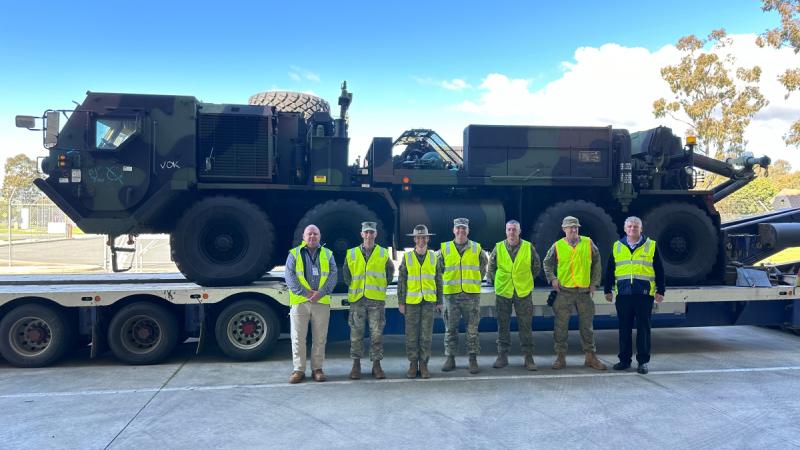Australian and United States military personnel welcome the arrival of the first United States Army materiel to Wadsworth Barracks, Bandiana together site managers on 14 August 202