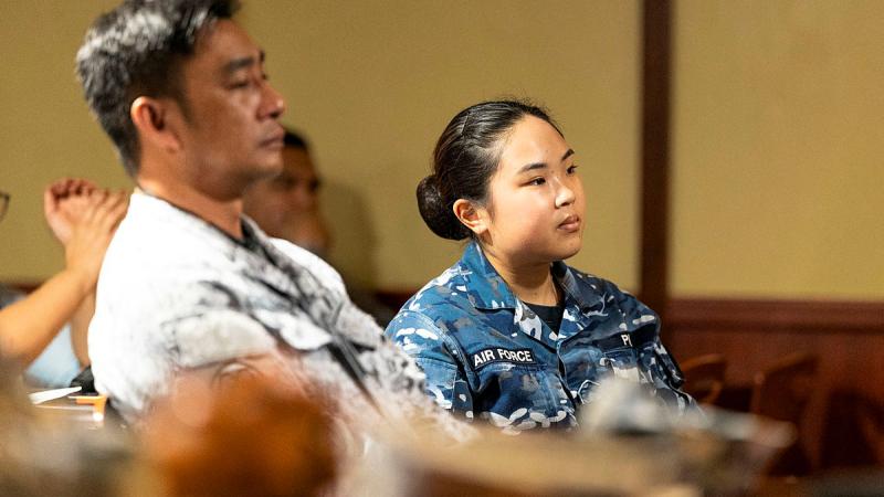 A RAAF officer takes part in a military law workshop on board HMAS Canberra in Manila, Philippines. Photos: Lance Corporal Riley Blennerhassett