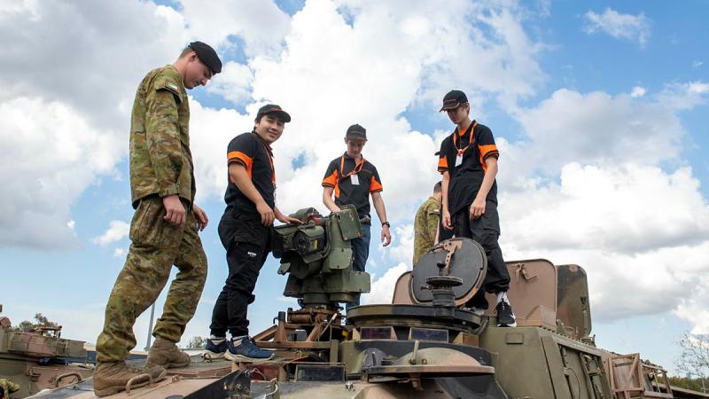 Members of the Defence Work Experience Program are shown an ASLAV by a soldier from 2nd/14th Light Horse Regiment (Queensland Mounted Infantry) at Gallipoli Barracks. 