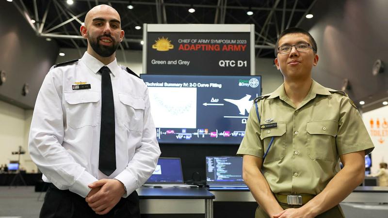 Able Seaman Joe Toce, left, and Signaller Andrew Lei, right, present their research on writing an algorithm to correctly analyse data from quantum sensors in radar at the Quantum Technology Challenge.