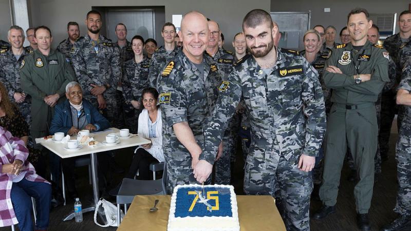 Commanding Officer HMAS Albatross, Captain Scott Palmer and the youngest sailor aboard, Able Seaman Casey Merriman slice a birthday cake during 75th anniversary celebrations for HMAS Albatross. Photos: Petty Officer Peter Thompson