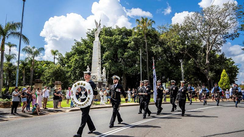 HMAS Maryborough personnel march past the Maryborough Cenotaph during their freedom-of-entry parade.
