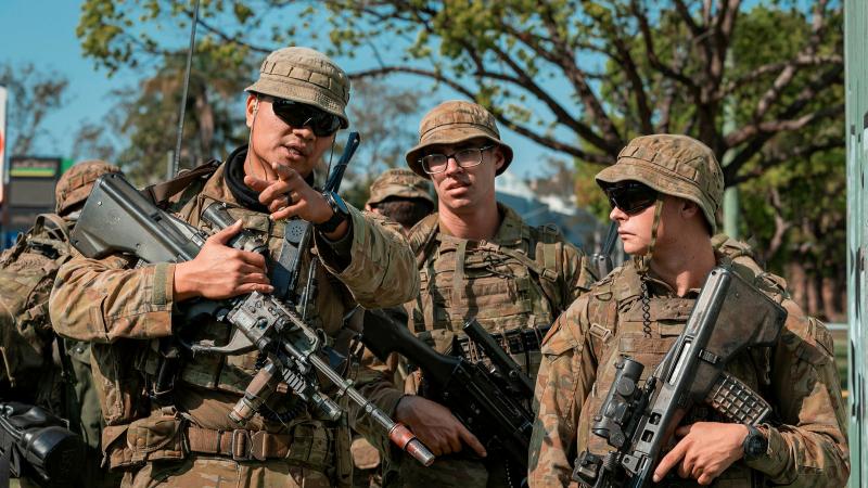 Soldiers of Combat Team Charlie from Battle Group Ram prepare to make entry into an abandoned section of Trinity College in Lismore as part of urban clearance training during Exercise Ever Ready Ram. Photos: Corporal Nicole Dorrett