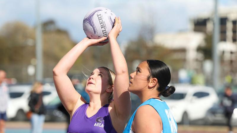 Officer Cadet Grace Belmar shoots for goal during the ADF women's netball team Grand Final game at Lyneham, Canberra. Photos: Leading Seaman Tara Morrison