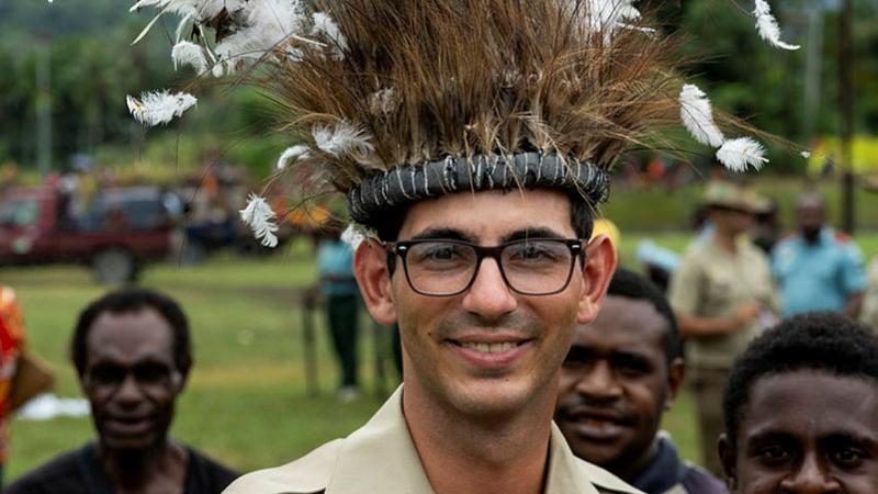 Australian Army soldier Private Mateo Goytizolo Butrica from 3rd Battalion, The Royal Australian Regiment, wears a traditional headdress gifted to him by locals during Independence Day celebrations, Wewak, Papua New Guinea. 